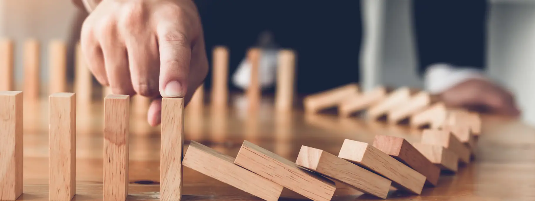 Domino Effect Halted By Businessman Domino Effect Halted By Businessman