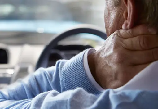 Driver Suffering From Whiplash_Spotlight Driver Suffering From Whiplash_Spotlight